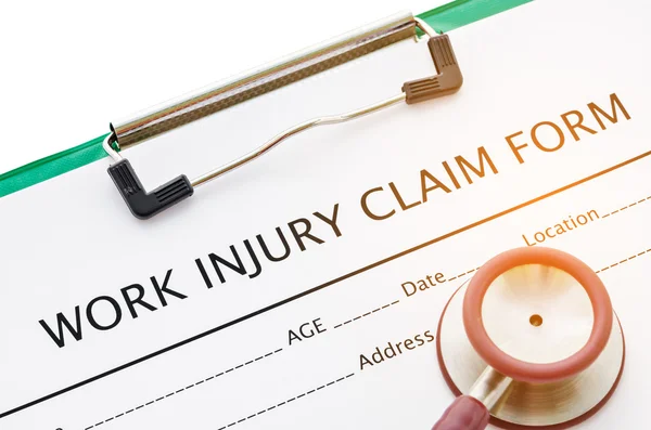 Claim form for an injury at work Stock Photo