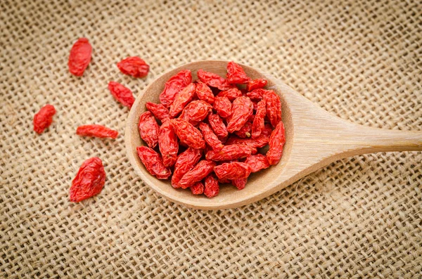 Goji berries in wooden spoon. — Stock Photo, Image