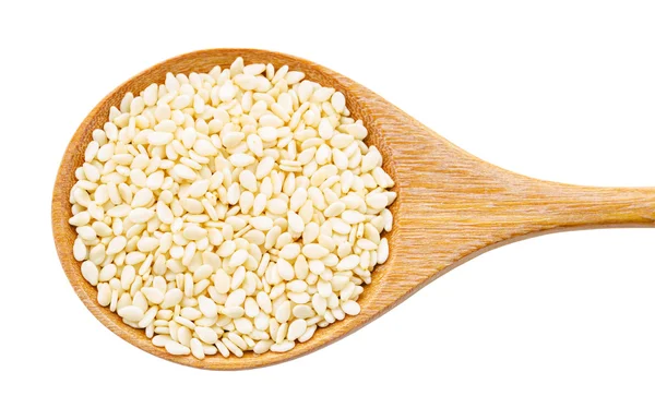 White sesame seeds in wooden spoon. — Stock Photo, Image