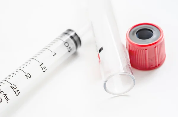 Syringe and Blank blood tube. — Stock Photo, Image