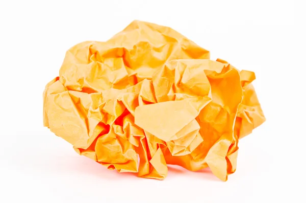 Primer plano de una bola de papel arrugado naranja . — Foto de Stock