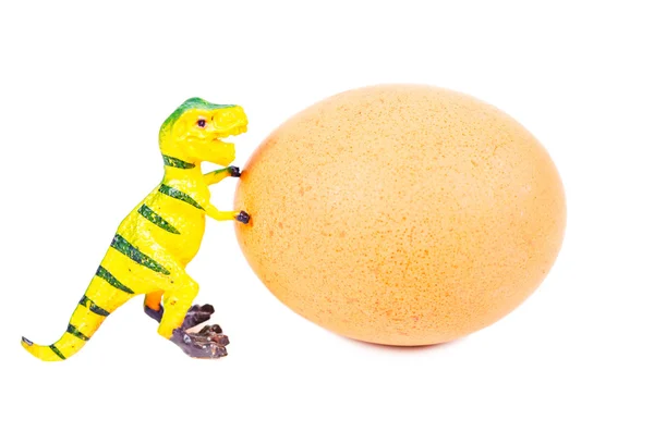Brinquedo de dinossauro de plasticina engraçado e ovo . — Fotografia de Stock