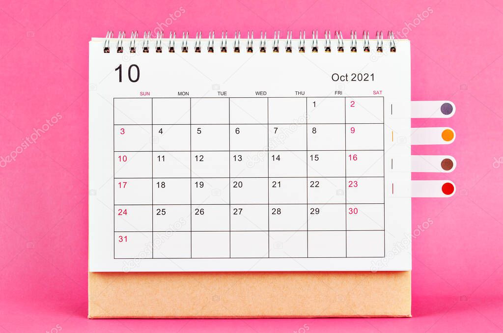 The October 2021 carlendar on pink background.