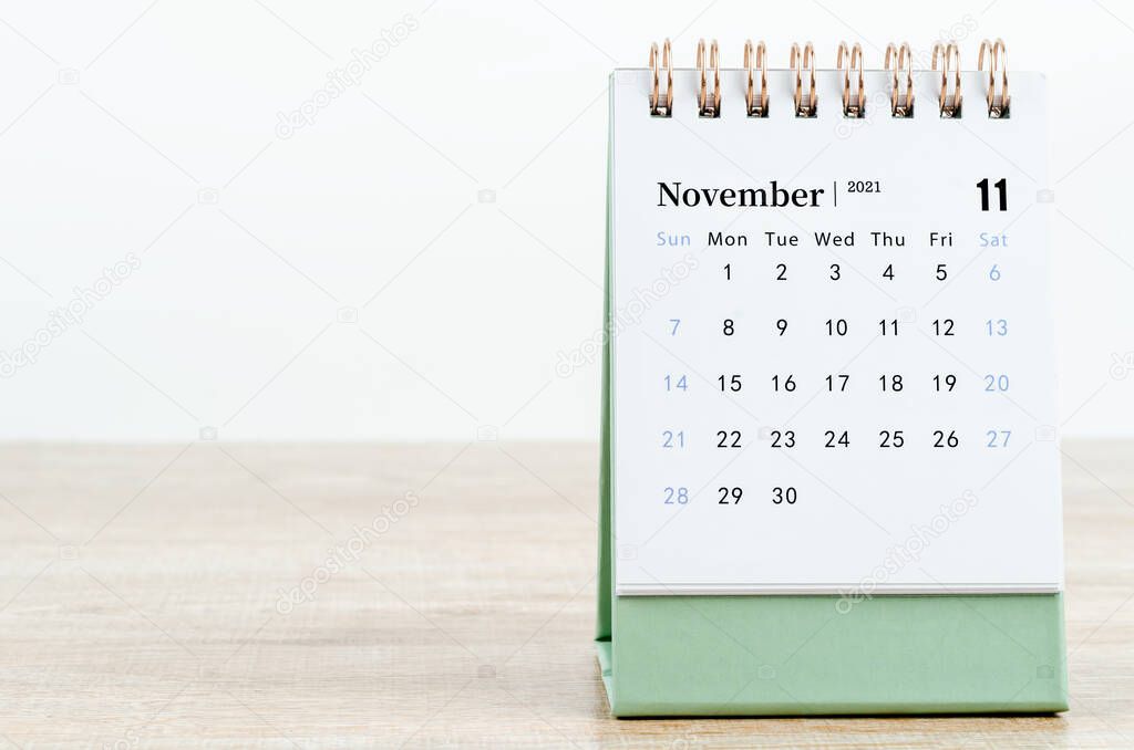 November Calendar 2021 on wooden table background.