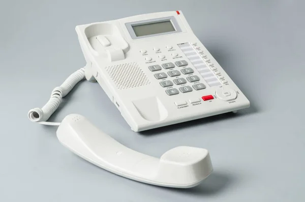 Biały Telefon Biuro Szarym Tle — Zdjęcie stockowe