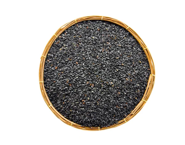 Semillas de sésamo negro en cesta de tejido . — Foto de Stock