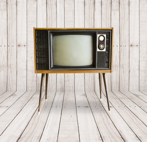 old television on wood background.