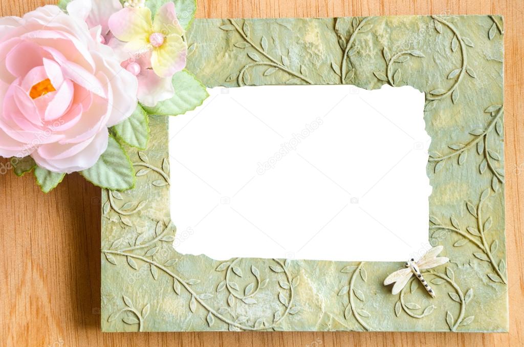 Blank phot frame and pink rose flower