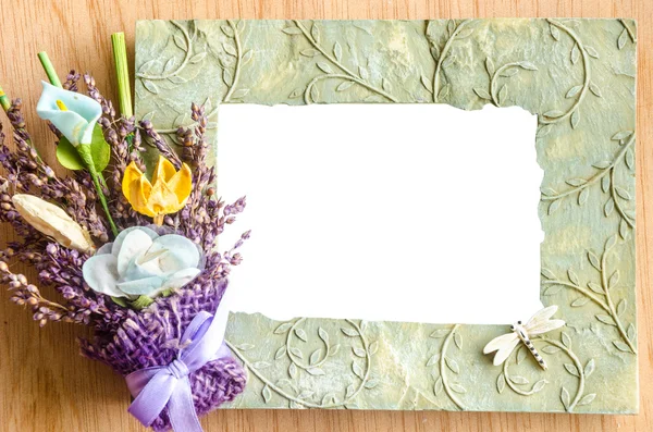 Blank photo frame and pink rose on wooden background. — Stock Photo, Image