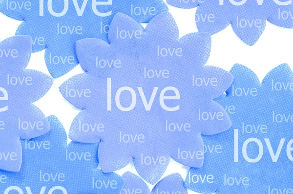 Love on blue paper flower. — Stock Photo, Image