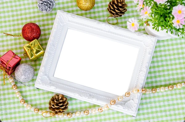 Vintage white photo frame with christmas decoration with flower. — Stock Photo, Image