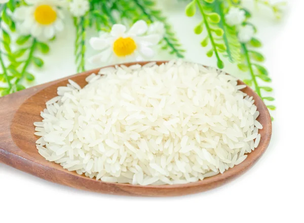 Jasmine rice in wooden spoon. — Stock Photo, Image