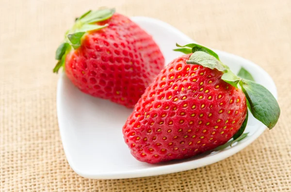 Ripe red strawberries in white cup. — Stock Photo, Image