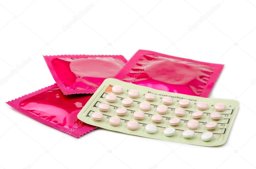 Contraceptive Pill and condoms. Stock Photo by ©gamjai 89576490