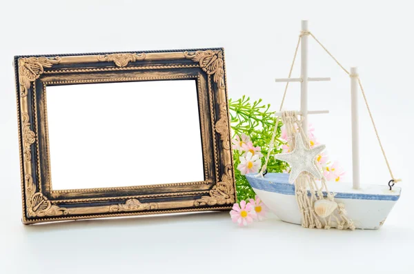 Old vintage blank photo frame and decorations. — Stock Photo, Image