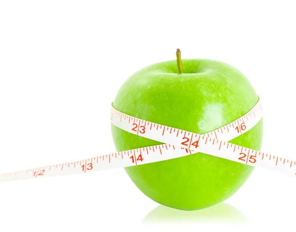 Green apples measured the meter. — Stock Photo, Image