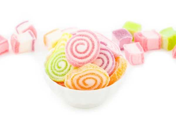 Colorful candy in white cup. — Stock Photo, Image