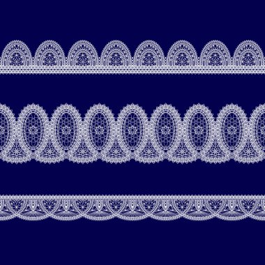 Beyaz dantel kurdeleler kümesi