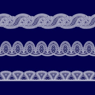 Beyaz dantel kurdeleler kümesi