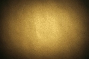 Kenarları koyu renkli sarı el işi kağıdının dokusu. Metin için boşluk.