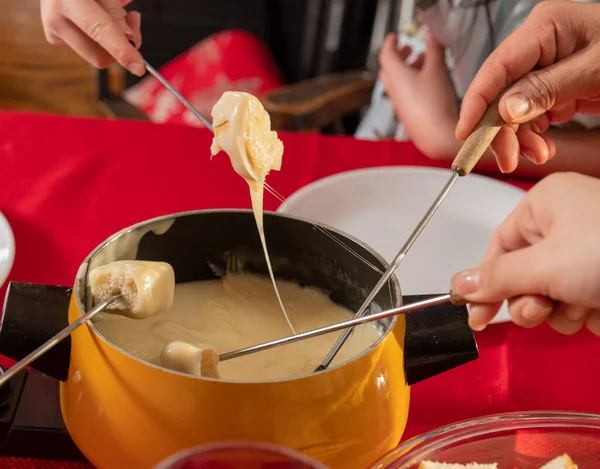 Bread Being Dipped Swiss Cheese Fondue Dinner — Stock Photo, Image