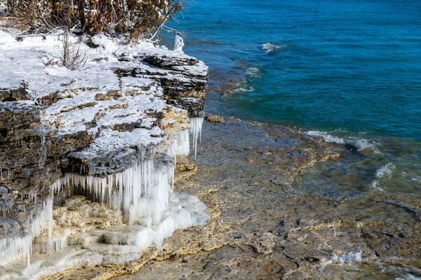 Cave point located in Door County Wisconsin with ice during winter
