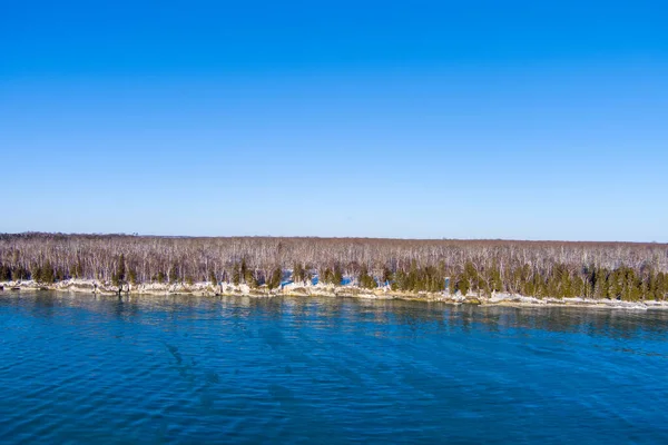 cave point located in Door County Wisconsin with ice during winter