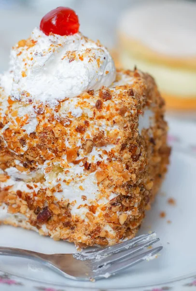 Creamy cake closeup with cherry on top — Stock Photo, Image