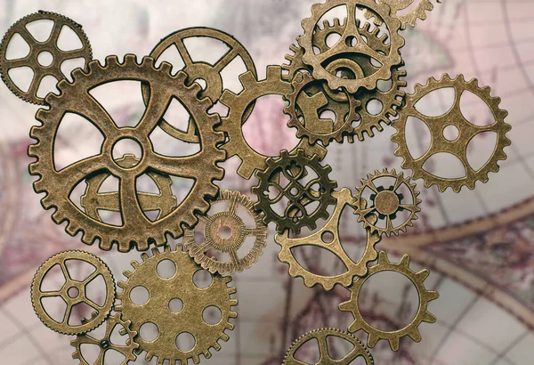 Cogs y engranajes con un mapa en el fondo. Concepto Steampunk. —  Fotos de Stock