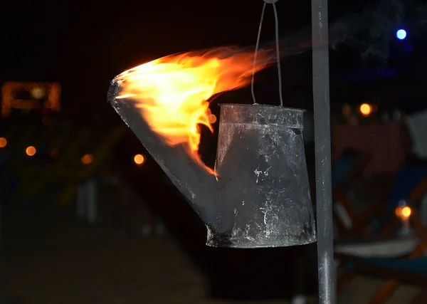 Flaming torch created from watering can photography — Stock Photo, Image
