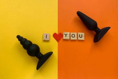 Sex toys. Black butt plag. Inscription I LOVE YOU. Useful for adult, sex shop