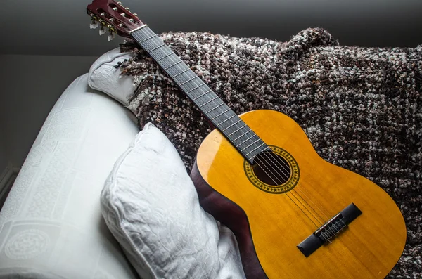 Acoustic Guitar on the white sofa — Stock Photo, Image