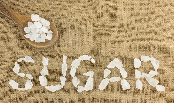 Fehér kristályos cukor rendezni, mint szó barna cukor — Stock Fotó