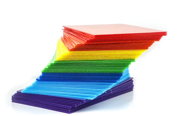 Stack of colorful  corrugated plastic sheets — Stock Photo, Image