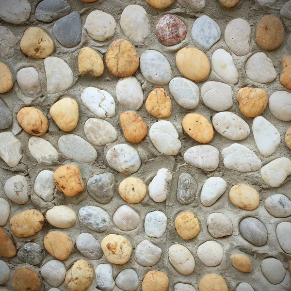 Hintergrund Aus Einer Nahaufnahme Einer Mauer Mit Kieseln — Stockfoto