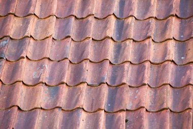 Background of red roof made of old tiles.