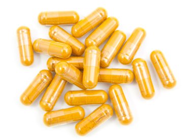 WHI üzerinde izole bir şişe dışarı dökülmesini ot zerdeçal kapsül