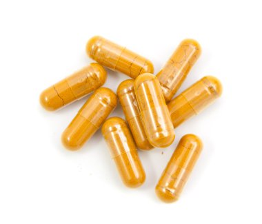 WHI üzerinde izole bir şişe dışarı dökülmesini ot zerdeçal kapsül