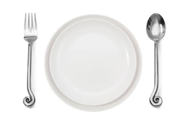 Lugar de la cena estableciendo un plato blanco con tenedor de plata y cuchara — Foto de Stock