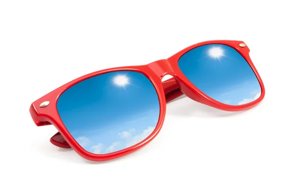 Red sunglasses with sky and clouds in reflection isolated — Stock Photo, Image