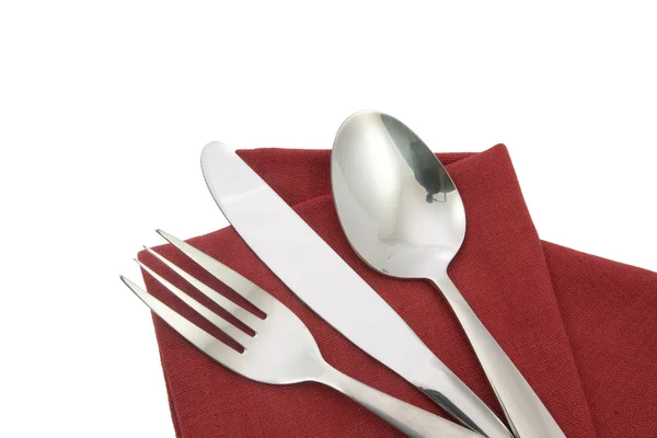 Fourchette et couteau sur serviette rouge isolé — Photo