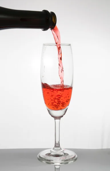 Red wine pouring  isolated — Stock Photo, Image