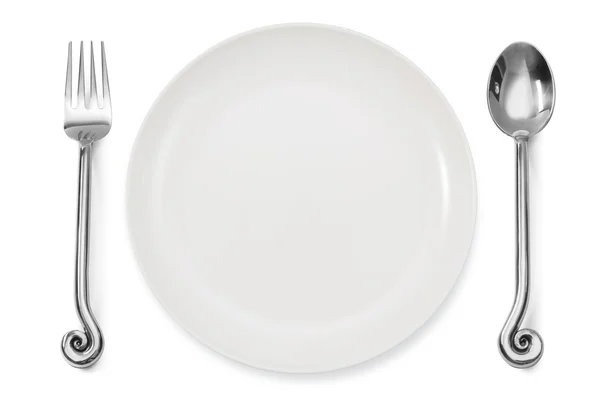 Dinner place setting a white plate with silver fork and spoon — Stock Photo, Image