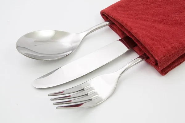 Tenedor y cuchillo en servilleta roja — Foto de Stock