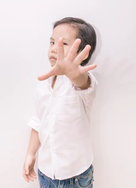 Asian kid and hand raise stop written on his hand — Stock Photo, Image