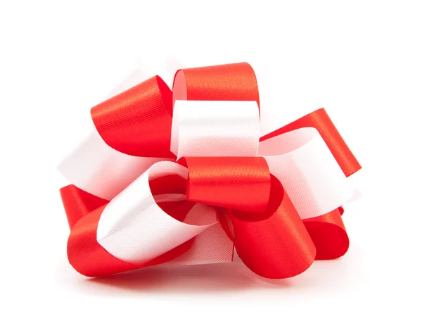Single red ribbon satin gift bow isolated — Stock Photo, Image