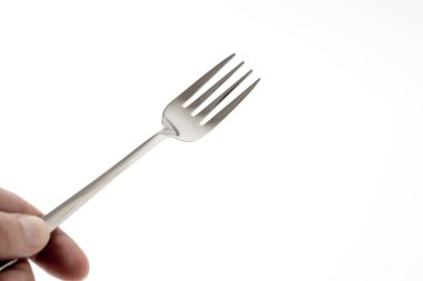 Beyaz arkaplanda gümüş çatal fotoğraf yığını