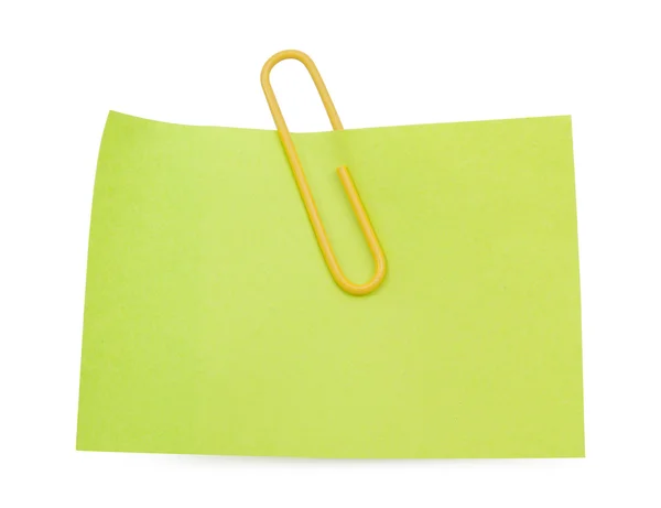 Green Note with yellow paper clip — Stock Photo, Image