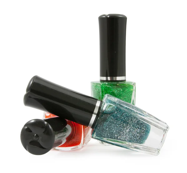 Green red  blue nail polish bottle on white background — Stock Photo, Image