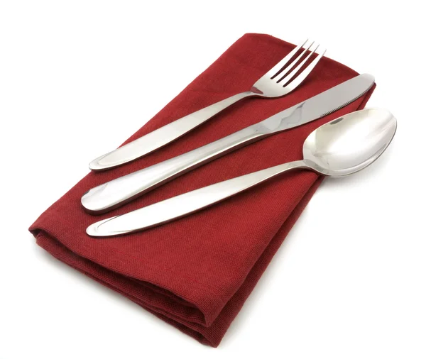 分離された赤いナプキンにナイフとフォーク — ストック写真